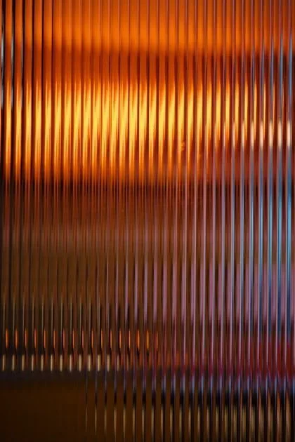Three flowing waves in blue, green, and orange—motion and progress at a glance.